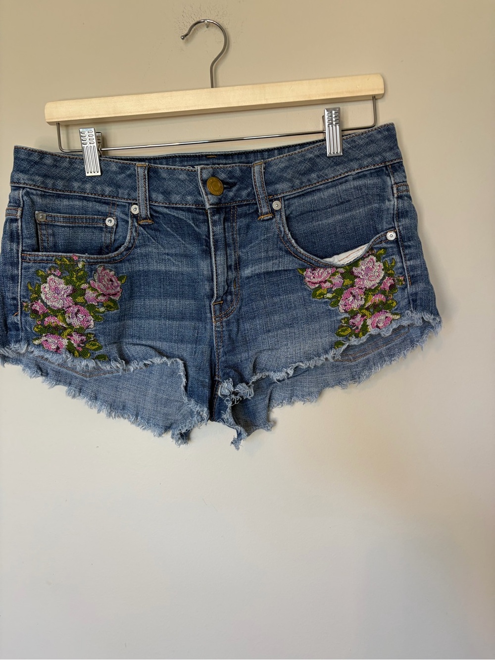 American Eagle Outfitters Distressed Denim Shorts with Pink Floral Embroidery